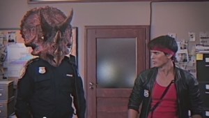 Renegade cop Kung Fury meats his strait-laced new partner Triceracop. No really, that's the whole joke.